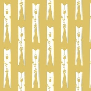 spring clothespins on gold