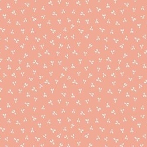 Tiny petals in cream on watermelon pink fabric