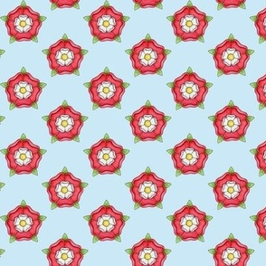 Tudor Rose ditsy pattern on light blue - small scale