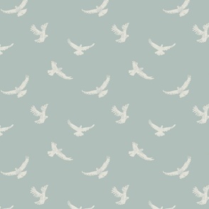 White coastal flying birds on light blue wallpaper