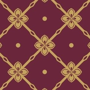 Antique gold diagonal garden trellis with simple geometric flower on  wine red