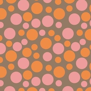M.  Pink and Orange Polka Dots on a soft brown background