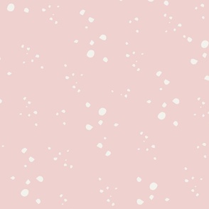 Scattered irregular dots and spots ivory on pink