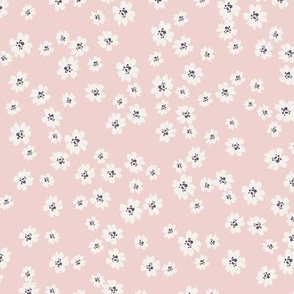 Ivory ditsy flowers tossed on muted pink