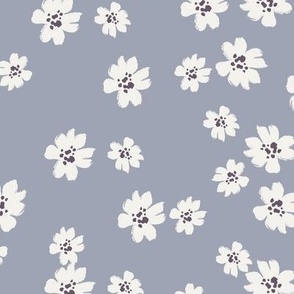 Ivory ditsy flowers tossed on muted purple