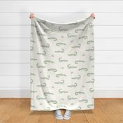 Green baby alligators on ivory for gender neutral nursery decor, wallpaper, and bedding