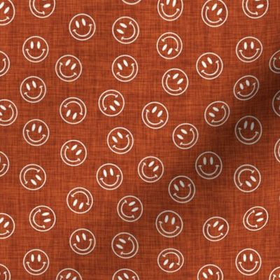 small rust linen + crema smiley face toss