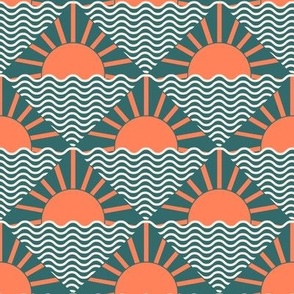 Sunset over the water in teal and orange