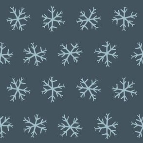 Medium hand drawn arctic snowflakes, snow blender print for gender neutral kids apparel in navy and pastel blue