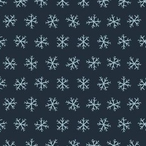 Small hand drawn arctic snowflakes, snow blender print for gender neutral kids apparel in navy and pastel blue