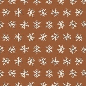 Small hand drawn arctic snowflakes, snow blender print for gender neutral kids apparel in dark brown and tan