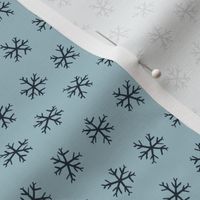 Small hand drawn arctic snowflakes, snow blender print for gender neutral kids apparel in navy and pastel blue