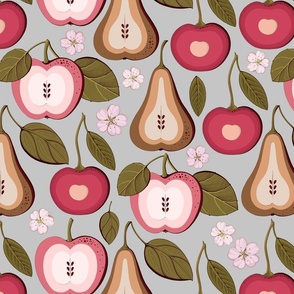 Fruit treats, pear, cherry and pink apples on a gray background