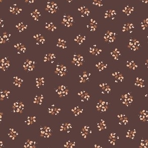 hand-drawn brown small flower bunches on dark brown