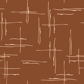 hand drawn vanilla cross lines on bright dark brown