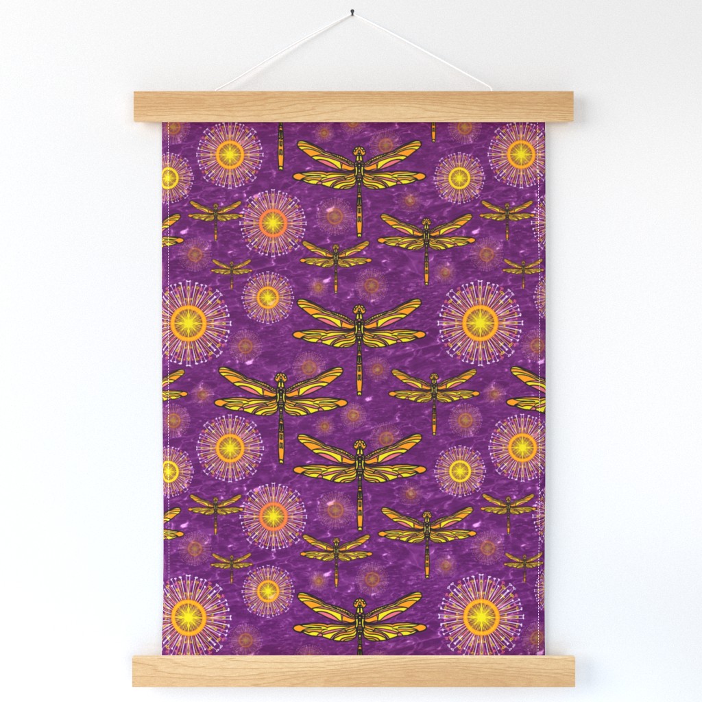 Colourful yellow and orange  dragonflies and seedheads  over sparkling effect water 12” Repeat rich purple 