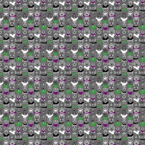 Small Dog pride in purple and green bandanas