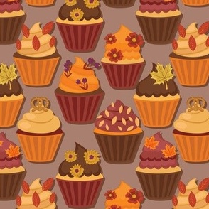 Autumn cupcakes on pale brown background