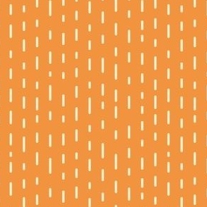 Vertical white dashed stripes on orange