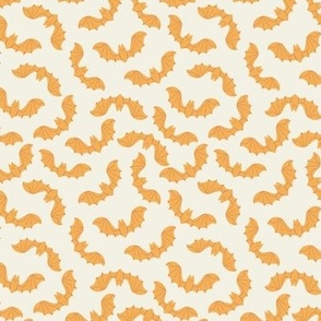 Small halloween orange bats on cream