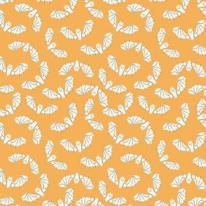 Small halloween white bats on orange