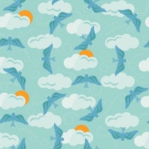 Small-scale, scattered sky design with aqua clouds, blue birds, and orange suns with fun movement. 
