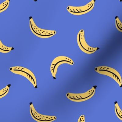 Graphic bananas on bright blue background - yellow tropical fruits - small scale