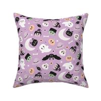 cute pastel halloween monster faces on lilac lavender violet