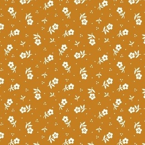 Small flowers scattered non-directional Vintage fabric  in desert gold and natural white