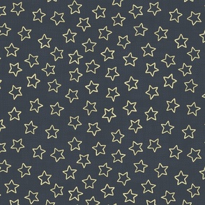 Sparkly gold stars on woven dark blue background
