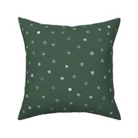 Tiny Snowflakes Scattered on Green Background (medium)