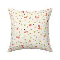 Red cherries with green and pink spots and triangles on cream