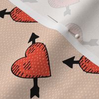 Hand drawn cupid hearts with arrows in red on tan beige Small scale
