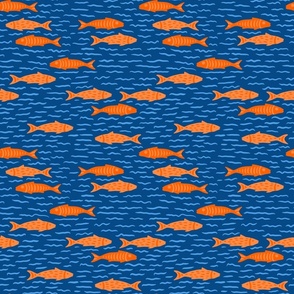 Orange Fish on Blue Sea Background