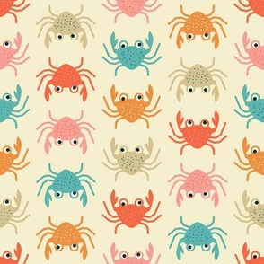 Colorful cute fun crabs on yellow beach sand, red, orange, teal 