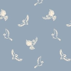 Chickadee birds flying - painted ivory white birds in flight. Line drawings on baby blue / cornflower blue. Kittiwake paint color.