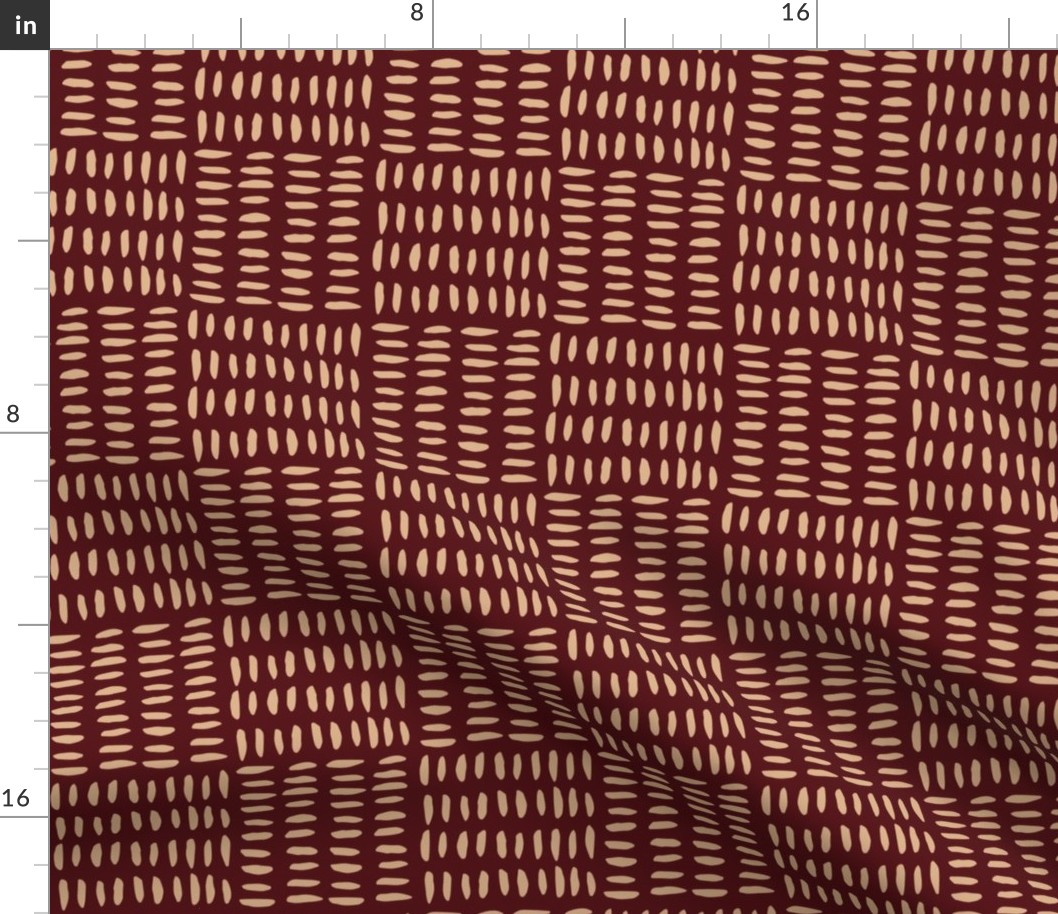 Modern abstract geometric painted pattern of dashes in squares on burgundy / auburn red with tan brown