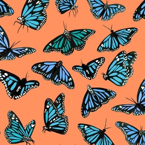 hand painted monarch butterflies in blue on a orange background 