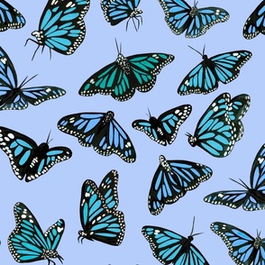 hand painted monarch butterflies in blue on a blue background