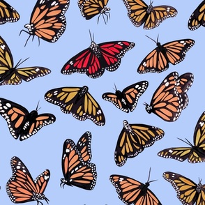 hand painted monarch butterflies in orange on a blue background 