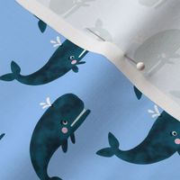 Swimming Whales on Sky Blue