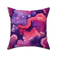 fluid art geode in red and purple and pink 