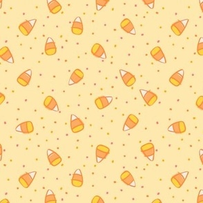 Pastel Halloween Candy Corn with Confetti Sprinkles on Pastel Yellow 