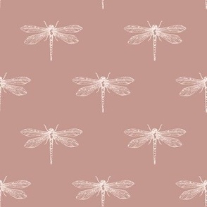 White hand-drawn dragonflies on dusty rose pink background