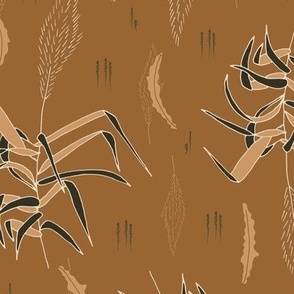 taupe and brown grass twigs and leaves on bright copper meadow