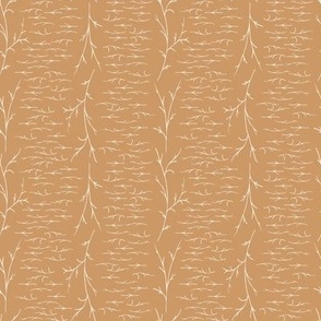 white grass twigs in horizontal and vertical lines on orange honey brown