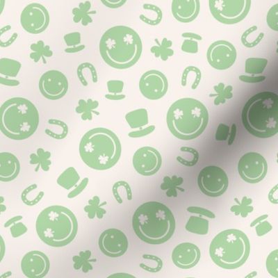 Saint Patrick's Day tossed icons - smileys lucky shamrock and leprechaun hat mint green on ivory 