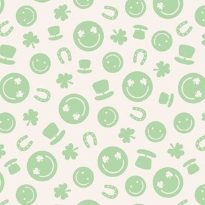 Saint Patrick's Day tossed icons - smileys lucky shamrock and leprechaun hat mint green on ivory 