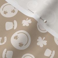 Saint Patrick's Day tossed icons - smileys lucky shamrock and leprechaun hat ivory sand on latte beige tan 