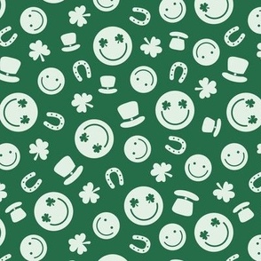 Saint Patrick's Day tossed icons - smileys lucky shamrock and leprechaun hat mist green on pine 